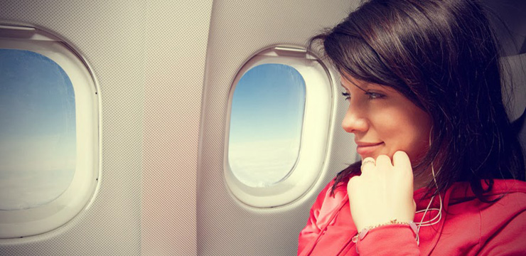 Woman-Sitting-In-The-Airplane1